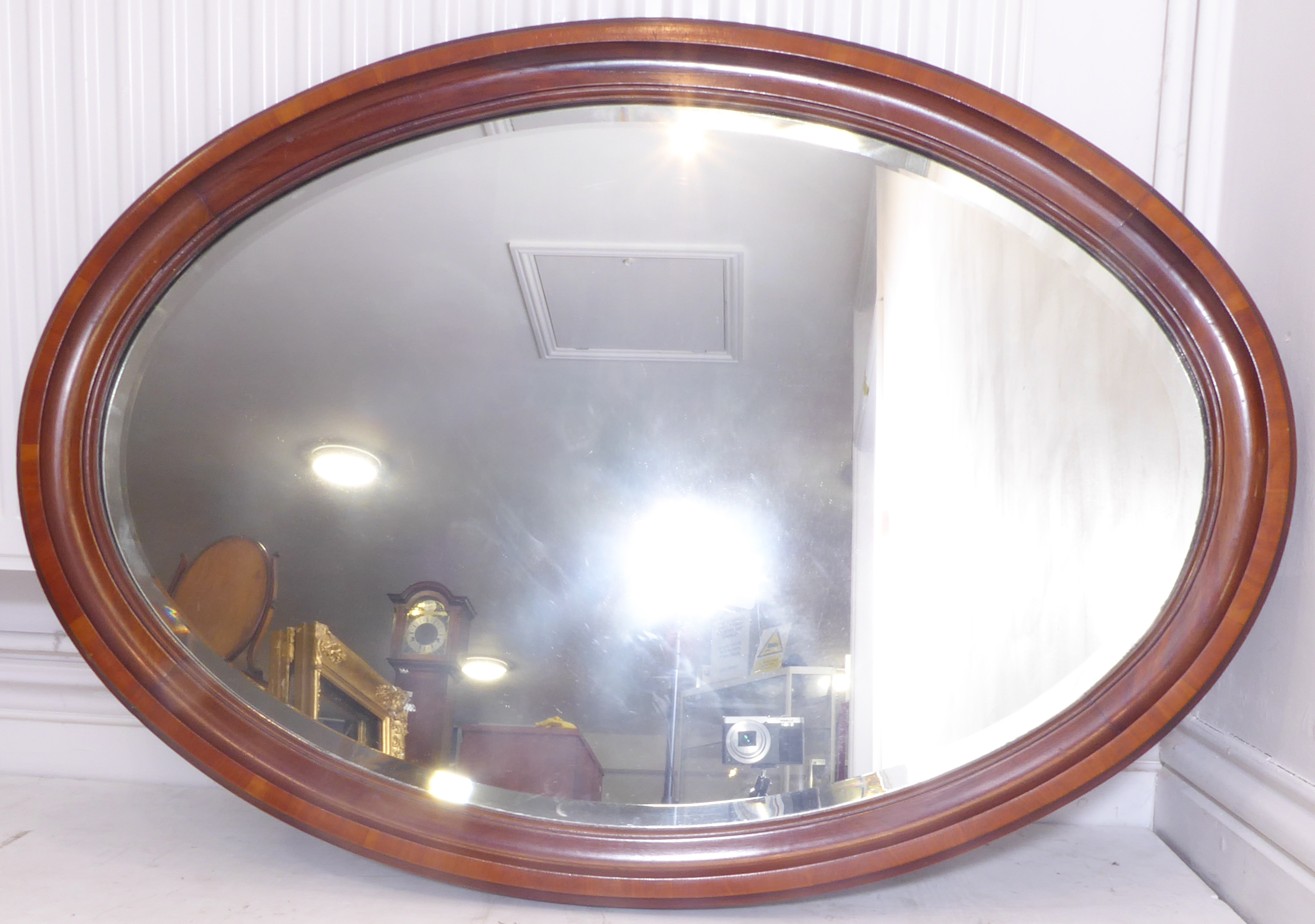 An early 20th century oval mahogany wall-hanging looking glass having bevelled plate (85.5cm x - Image 2 of 4