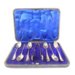 A cased set of six hallmarked silver teaspoons together with matching sugar tongs, assayed Sheffield