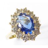 An 18-carat sapphire and diamond cluster ring (matches Lot 201), size