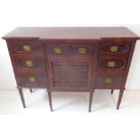 An early 20th century mahogany side cabinet in late 18th century George III style – the breakfront