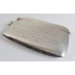 A hallmarked silver vesta case with presentation inscription reading 'R.H. Adshead - in appreciation