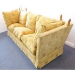 A 3-seater Knowle sofa; gold upholstery with Latin script