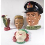 A painted plaster head advertising Senior Service cigarettes, together with a smaller Art Deco-style