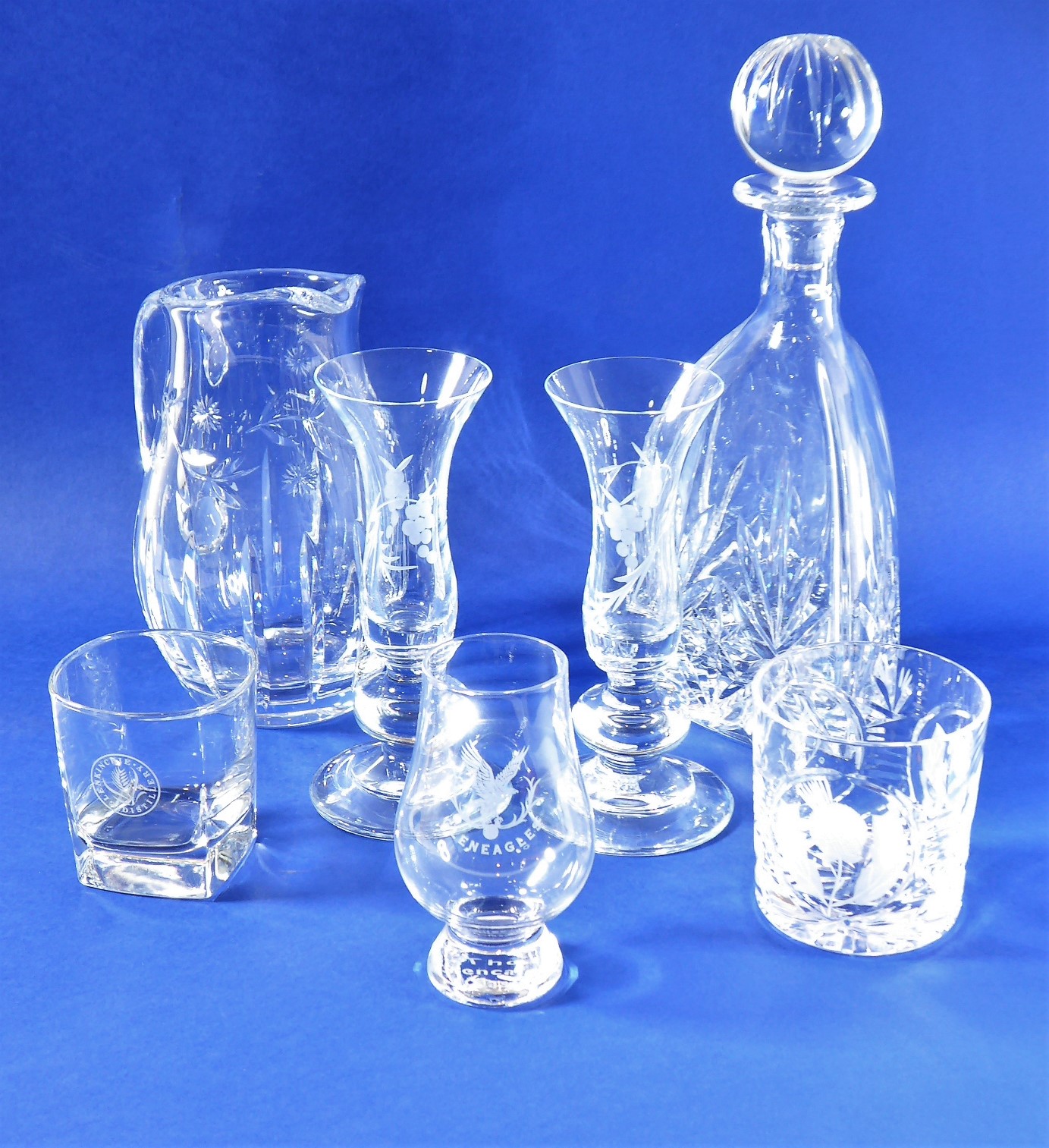 A very fine and heavy cut-glass crystal decanter of tapering triangular form, together with a cut-