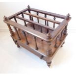 A mid 19th century three-division rosewood Canterbury; single full-width drawer and turned