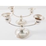 A pair of early 20th century sterling silver two-light table candelabra