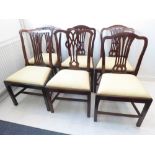 A set of four late 19th century Hepplewhite period mahogany dining chairs having pierced splats