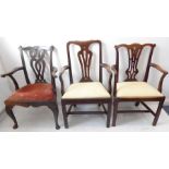 Three Chippendale-style mahogany carver armchairs each with drop-in seat