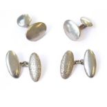 Two pairs of oval silver cufflinks