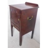 A George III period mahogany bedside-style cabinet; the moulded top with galleried back above a