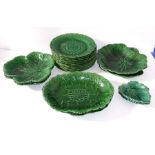 A selection of mid 19th century green glaze leaf moulded dishes by Wedgwood to include 12 circular
