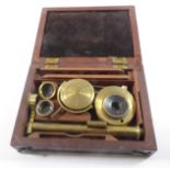 An early 19th century mahogany cased student-type travelling-microscope with mirror, lenses, stand
