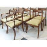 A good and long (10 + 2) set of Regency-style mahogany dining chairs; each with tablet-shaped top