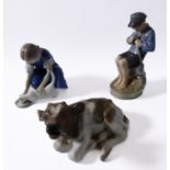 Royal Copenhagen porcelain figure group (mid 20th century, Danish factory), a seated young boy