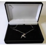 A silver pendant modelled as an open-winged swallow in flight upon a silver chain (boxed)