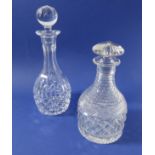 An early 19th century cut-glass mallet-shaped glass decanter having mushroom stopper and start-cut