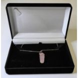 A tapering hexagonal silver mounted rose quartz pendant upon a silver chain (presentation box)