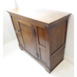 A good oak side cabinet (probably 18th century with restorations); the overhanging top above a