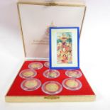 A boxed set of nine proof commemorative medallions (possibly Thai silver-gilt) with accompanying