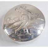 A silver pill box  –  the top embossed with a male golfer, import marks for Sheffield assay office