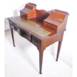 An Edwardian carved mahogany and boxwood-strung satinwood crossbanded lady's bureau de dame; the