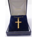 A 9-carat gold crucifix and chain (boxed)