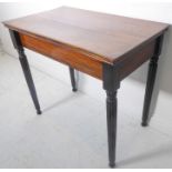 A mahogany side table; the slightly overhanging top above four turned tapering reeded legs (75.5cm