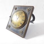 An unusual 19th century desk clock with easel stand; the brass dial with Roman numerals and with