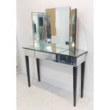 (Matches previous lot). A modern dressing table and matching freestanding three-section mirror.