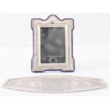 A white-metal easel picture frame and a finely engraved white-metal Middle Eastern tray with
