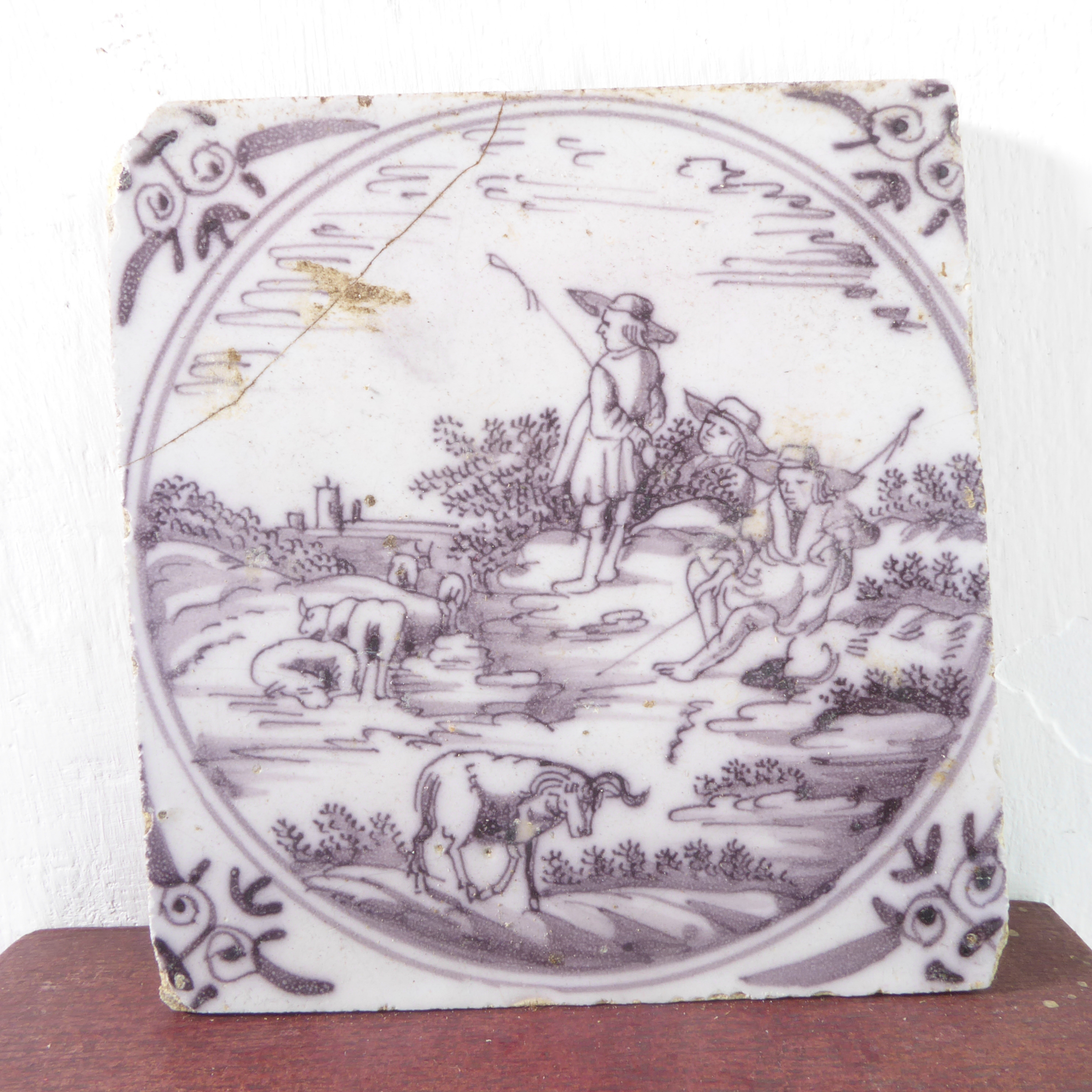 Thirteen early puce-coloured Delftware tiles (probably 18th century) with unusual depictions to - Image 14 of 15