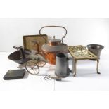 A good selection of early metalware to include a copper range kettle, large chamberstick, 18th /