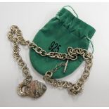 A heavy silver necklace within green velvet pouch (51cm)