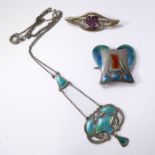An Art Nouveau enamel and silver pendant by Charles Horner; of trailing openwork design with pale