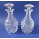 A pair of 19th century cut-glass decanters; mallet-shaped and with mushroom stoppers; hobnail-cut