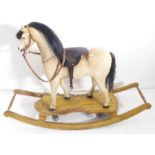 A fine early 19th century rocking horse – the bow rocker detachable to allow a push-along version.