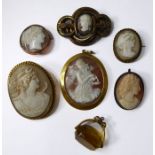 An oval shell cameo pendant depicting a fairy pouring from an urn (cracked) to the collet frame