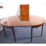 A large circa 1795 demilune mahogany dining table with drop-down leaf and removable leaf, raised