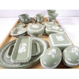 A selection of Wedgwood green Jasperware to include trinket boxes, dishes, vases and decorative eggs
