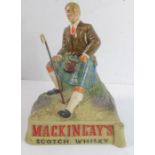 A Mackinlay's Scotch Whisky advertising figure, righthand thumb away (approx. 19cm high)