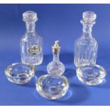 A pair of hexagonal cut-glass decanters (one with Crown Staffordshire 'Brandy' label), together with
