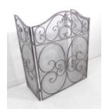 An ornate grey-metal fire screen; retailed by Cox and Cox (80cm high, 64cm front and 31cm sides)