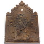 A large and heavy cast-iron fire back in 17th century style, decorated with a rider being offered