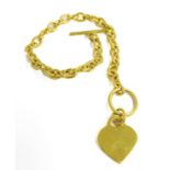 An Italian hallmarked silver gilt bracelet with an unengraved heart-shaped pendant (in