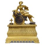 PENDULE "À LA SULTANE" en bronze doré, représentant une jeune femme assise, l'avant-bras appuyé