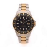 ROLEX GMT MASTER. REF. 16753 VERS 1980 Montre bracelet en acier et or jaune avec second fuseau