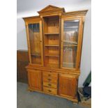 PINE BOOKCASE WITH 2 GLAZED PANEL DOORS,