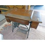 OAK CASED TREADLE SINGER SEWING MACHINE Condition Report: Top has scores / scratches.