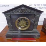 19TH CENTURY BLACK SLATE MANTLE CLOCK WITH METAL MOUNTS 30 CM TALL