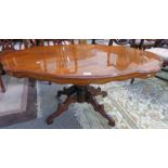 OVAL MAHOGANY COFFEE TABLE ON 4 SHAPED SUPPORTS,